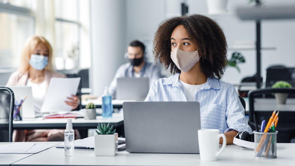 Person wearing protective mask at workplace
